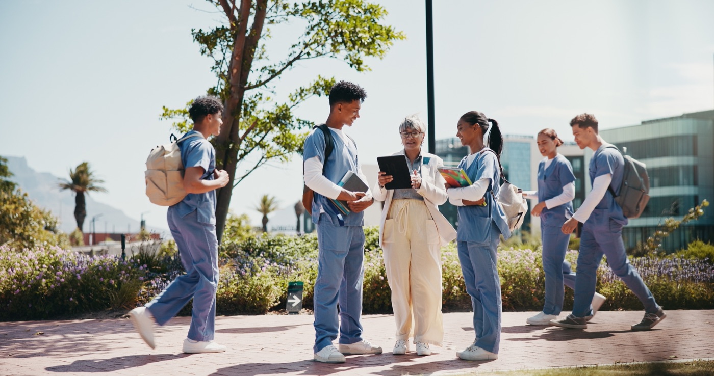 A mentor reviewing work with nontraditional medical students
