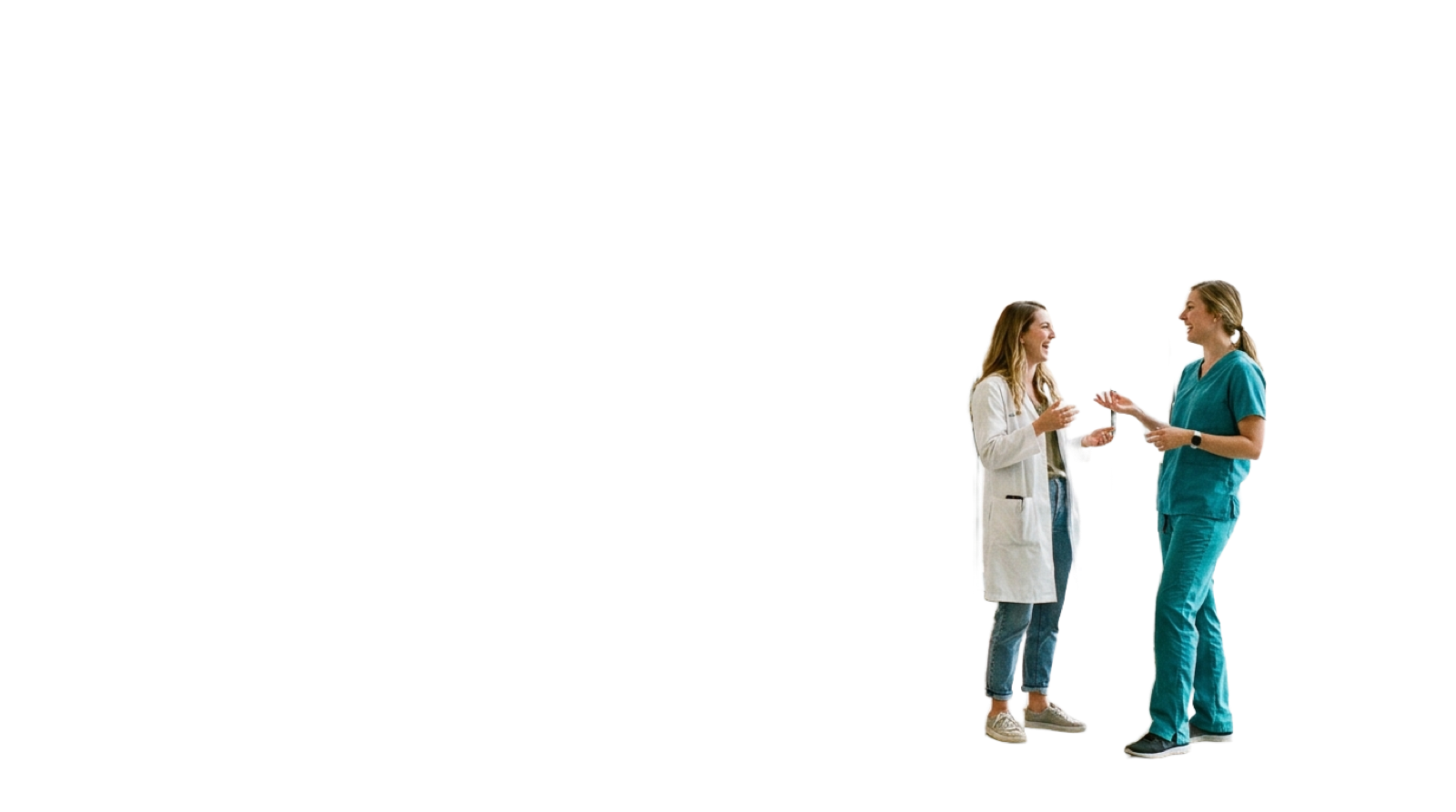 Two nontraditional medical students in a bright hospital atrium